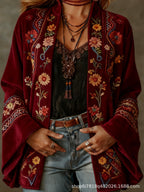 Women's long floral open-front cardigan with patterned borders and flared cuffs
