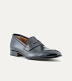 Black men's penny loafer with glossy finish and low heel