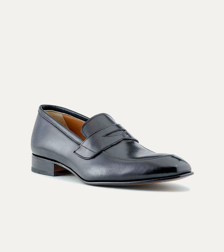 Black men's penny loafer with glossy finish and low heel