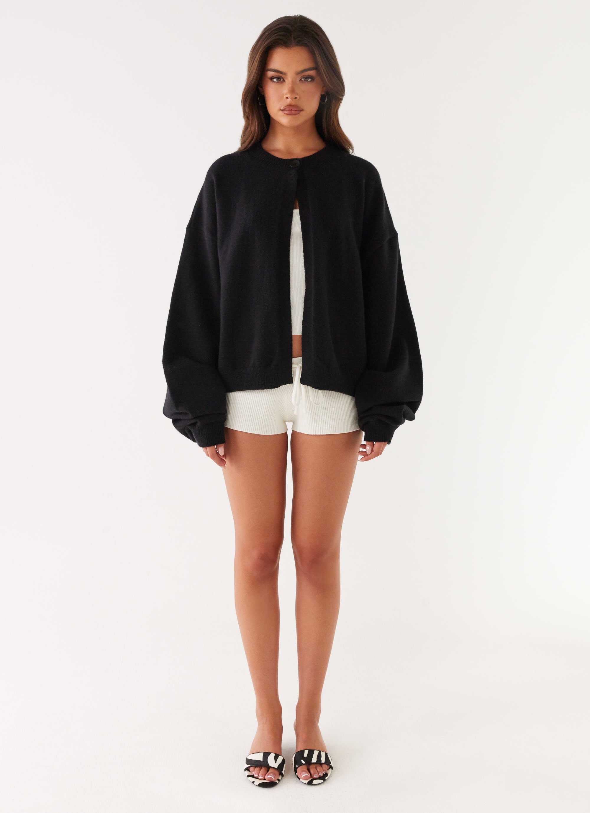 Women's black cardigan with one button and long sleeves