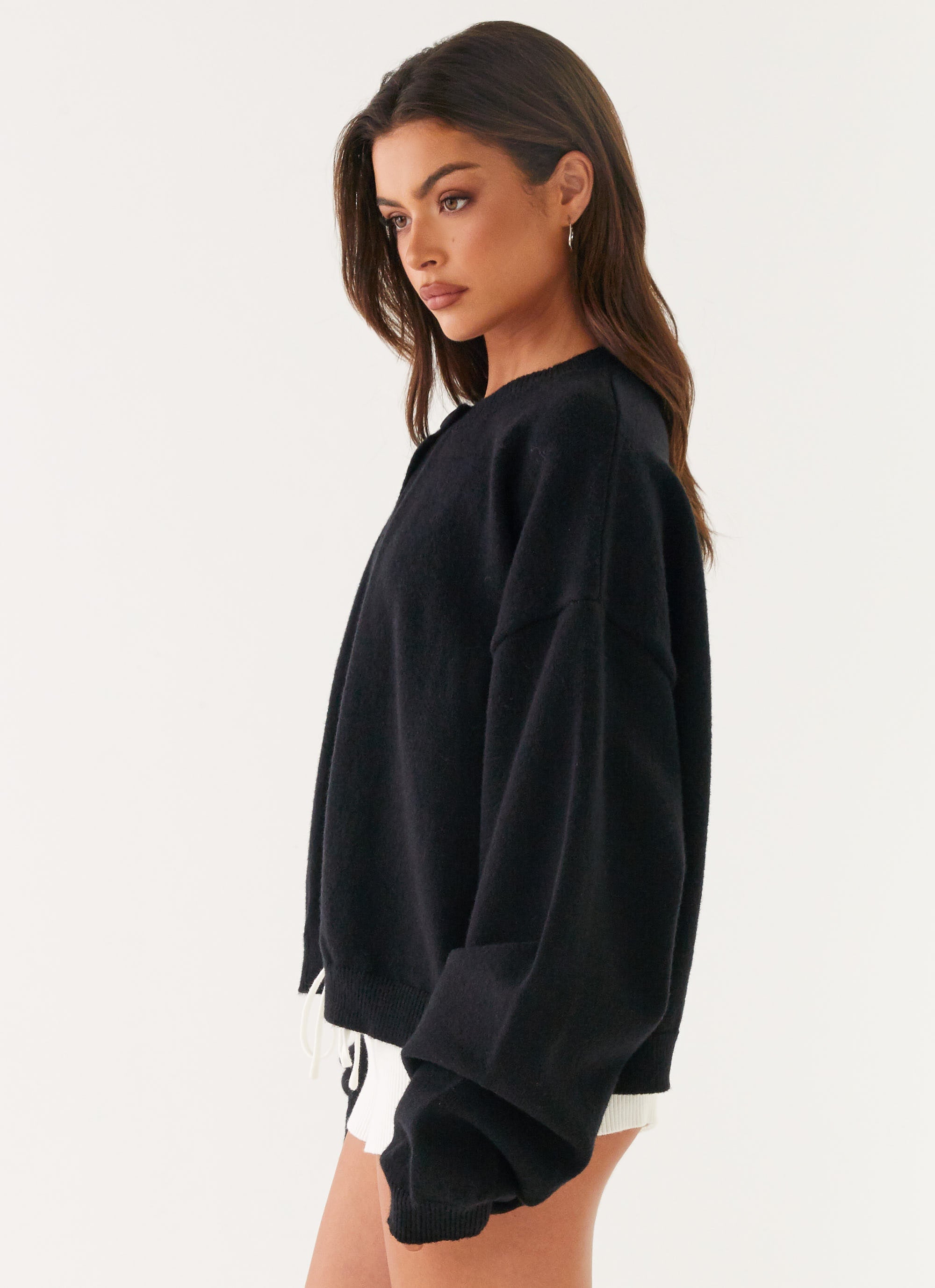 Women's black cardigan with one button and long sleeves