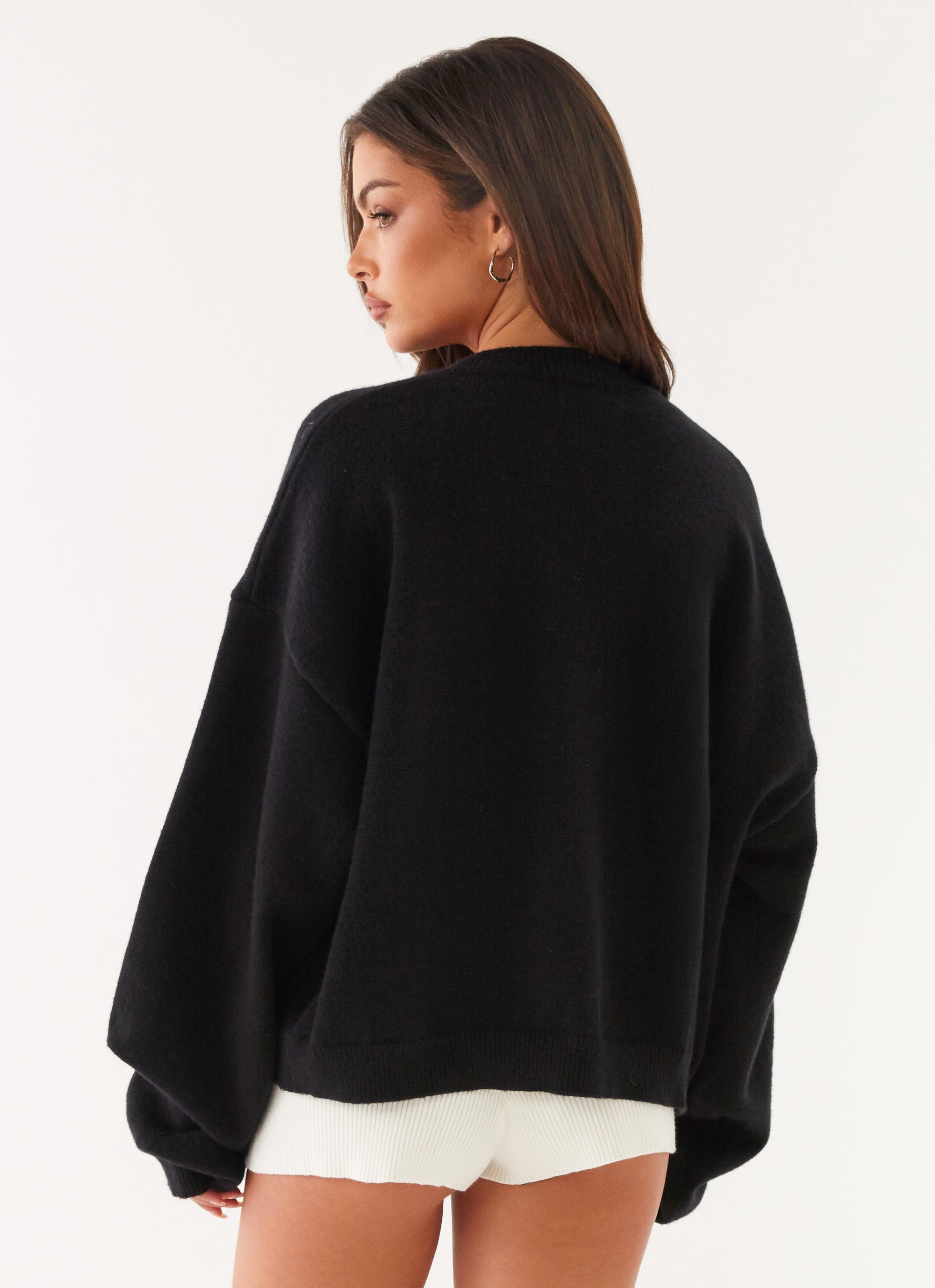 Women's black cardigan with one button and long sleeves