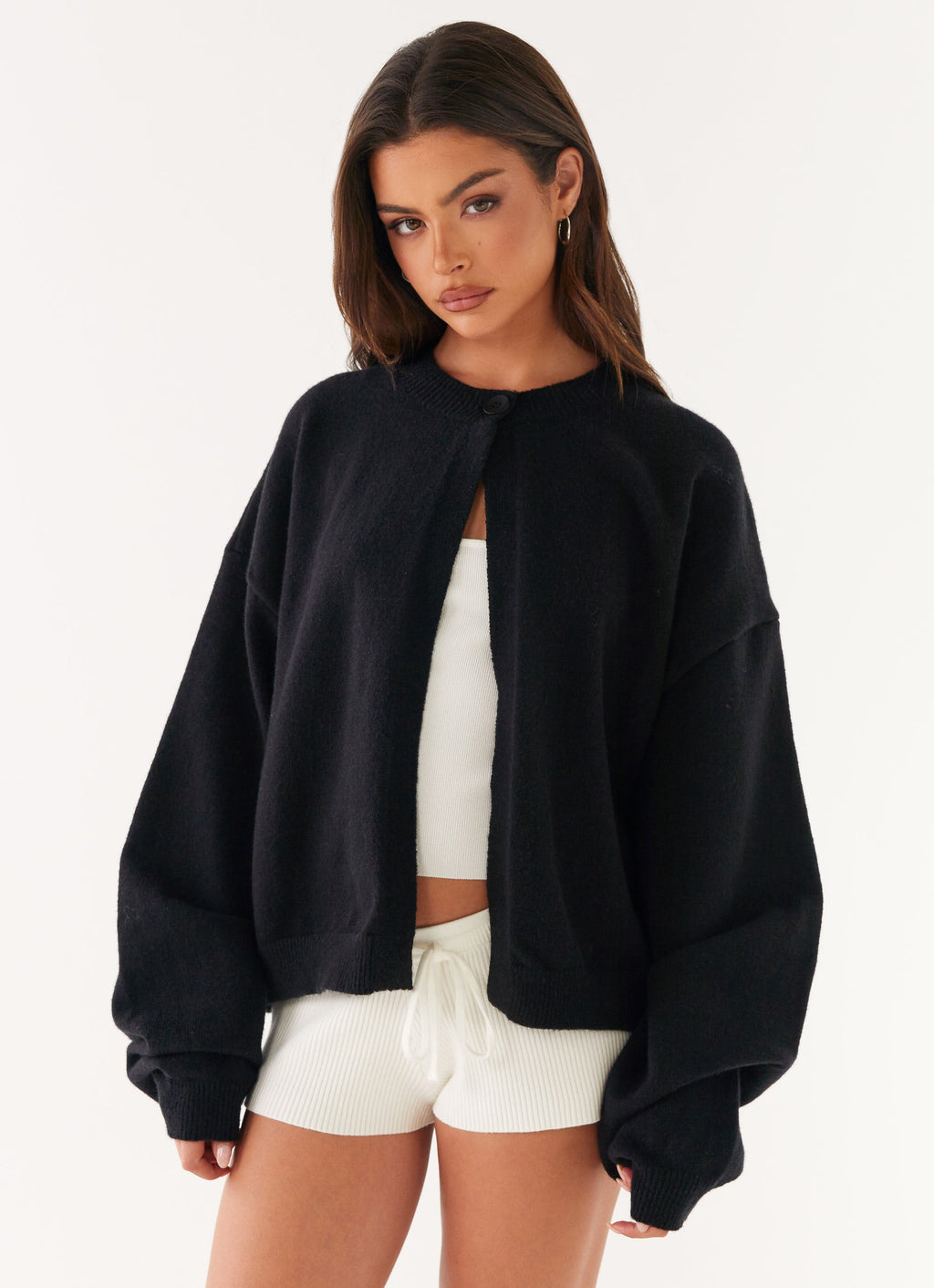 Women's black cardigan with one button and long sleeves