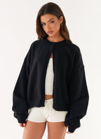 Women's black cardigan with one button and long sleeves