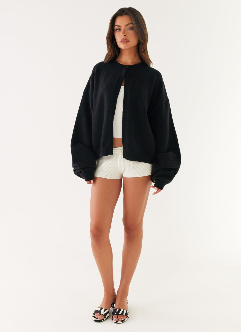 Women's black cardigan with one button and long sleeves