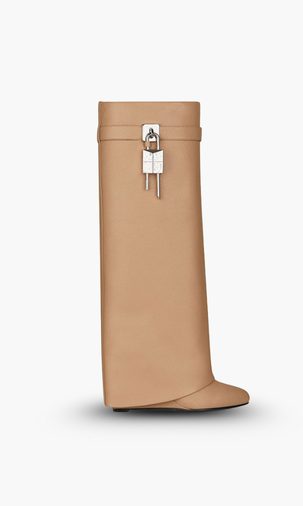 Women's knee-high platform boots with decorative buckle detail