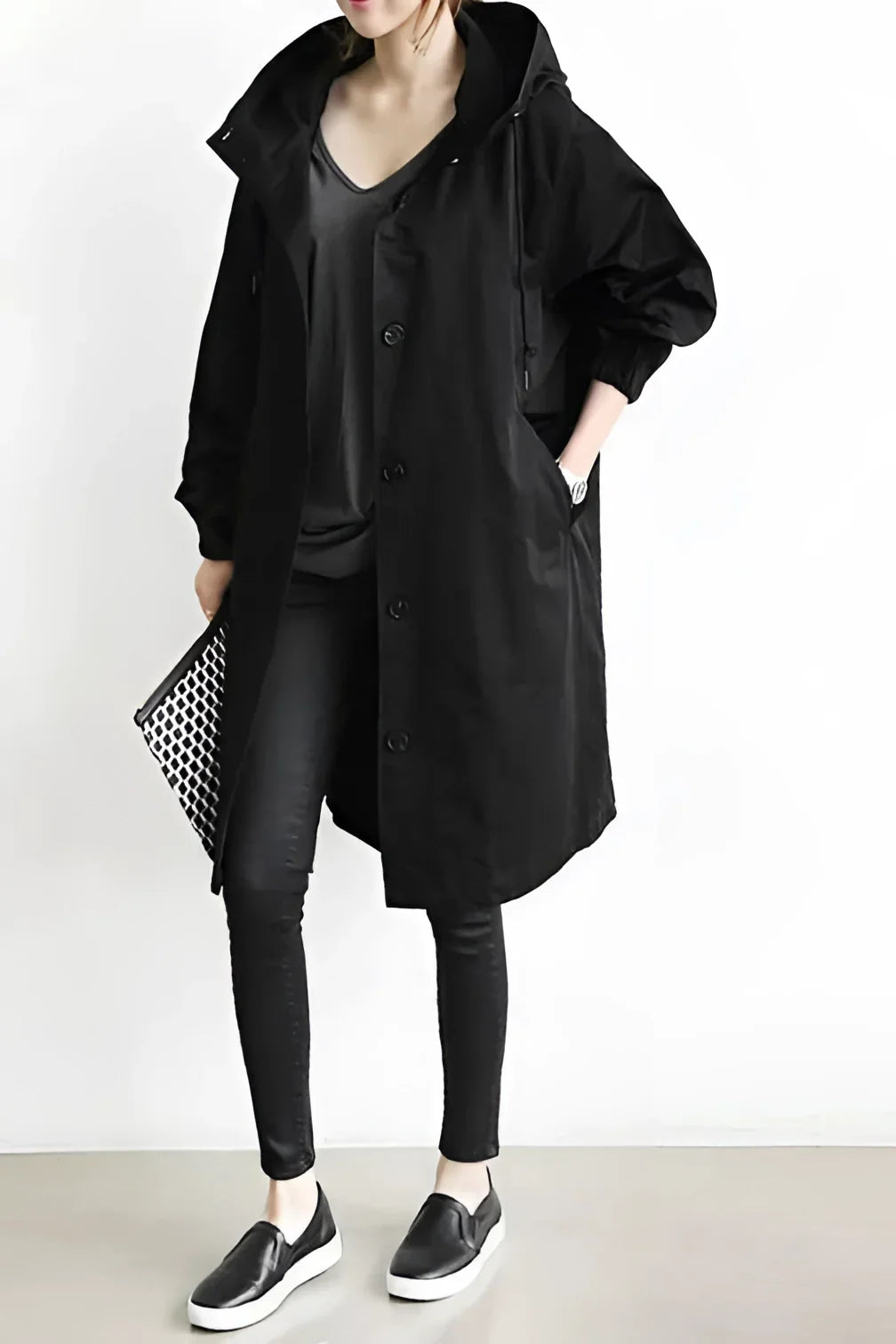 Women's long hooded trench coat with button front and elasticated cuffs