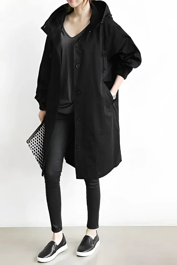 Women's long hooded trench coat with button front and elasticated cuffs