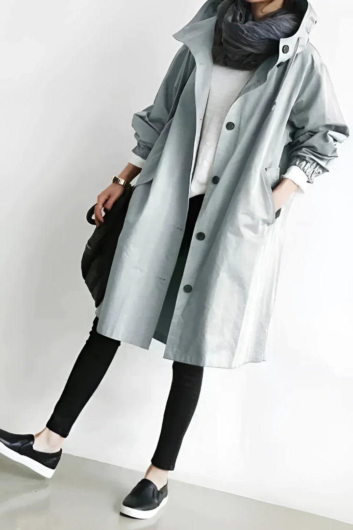 Women's long hooded trench coat with button front and elasticated cuffs