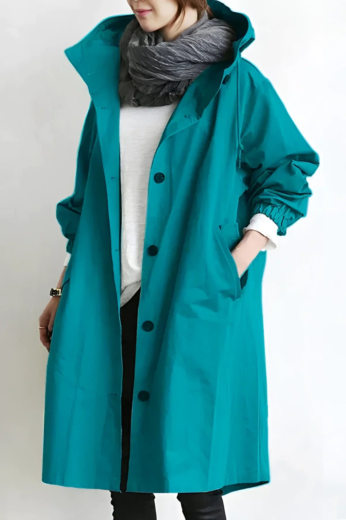 Women's long hooded trench coat with button front and elasticated cuffs