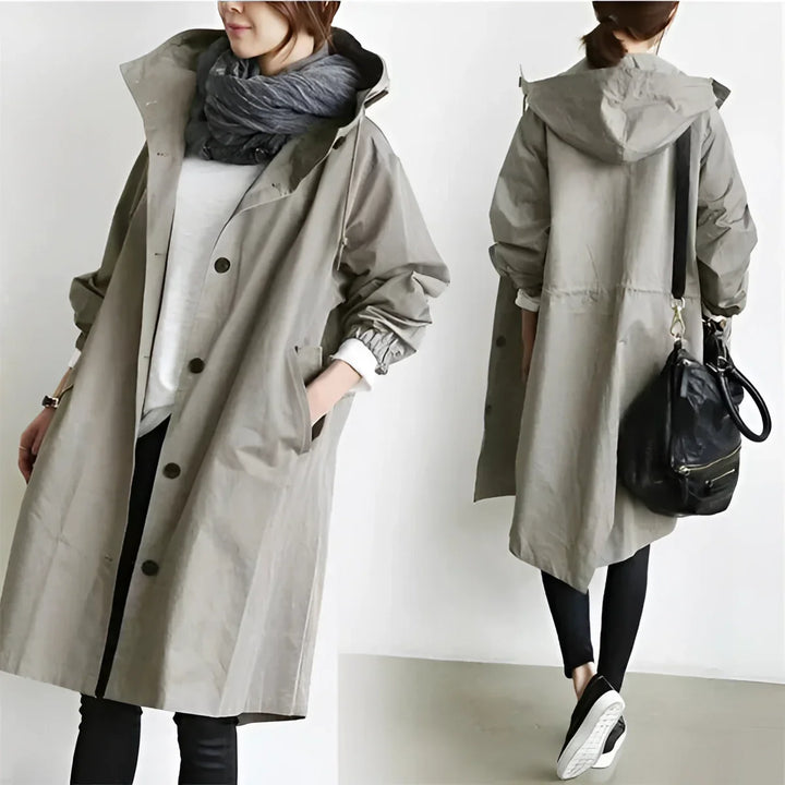 Women's long hooded trench coat with button front and elasticated cuffs