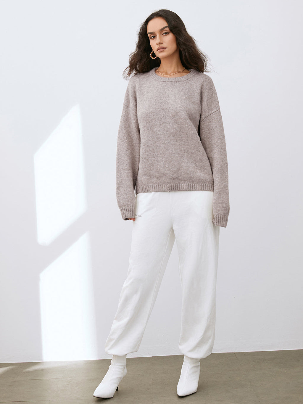 Women's camel crew neck jumper with long sleeves and ribbed trims
