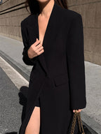 Women's long black tailored coat with lapels and one-button closure