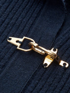 Women's cropped ribbed sweater with collar and metal buckle fastenings