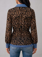 Women's leopard print blouse with blue contrast trim and long sleeves