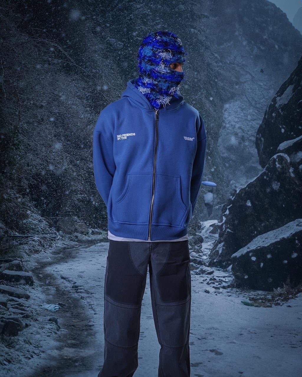 Men's blue zip-up hoodie with white chest text and front pouch pockets