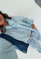 Women's blue striped cardigan with matching scarf