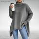Women's oversized turtleneck knit tunic sweater with long sleeves and an asymmetric hem