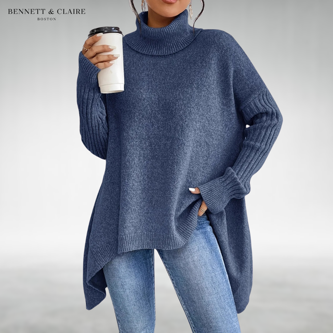 Women's oversized turtleneck knit tunic sweater with long sleeves and an asymmetric hem