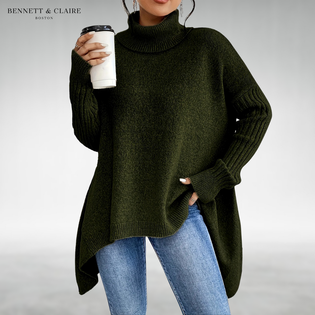 Women's oversized turtleneck knit tunic sweater with long sleeves and an asymmetric hem