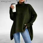 Women's oversized turtleneck knit tunic sweater with long sleeves and an asymmetric hem