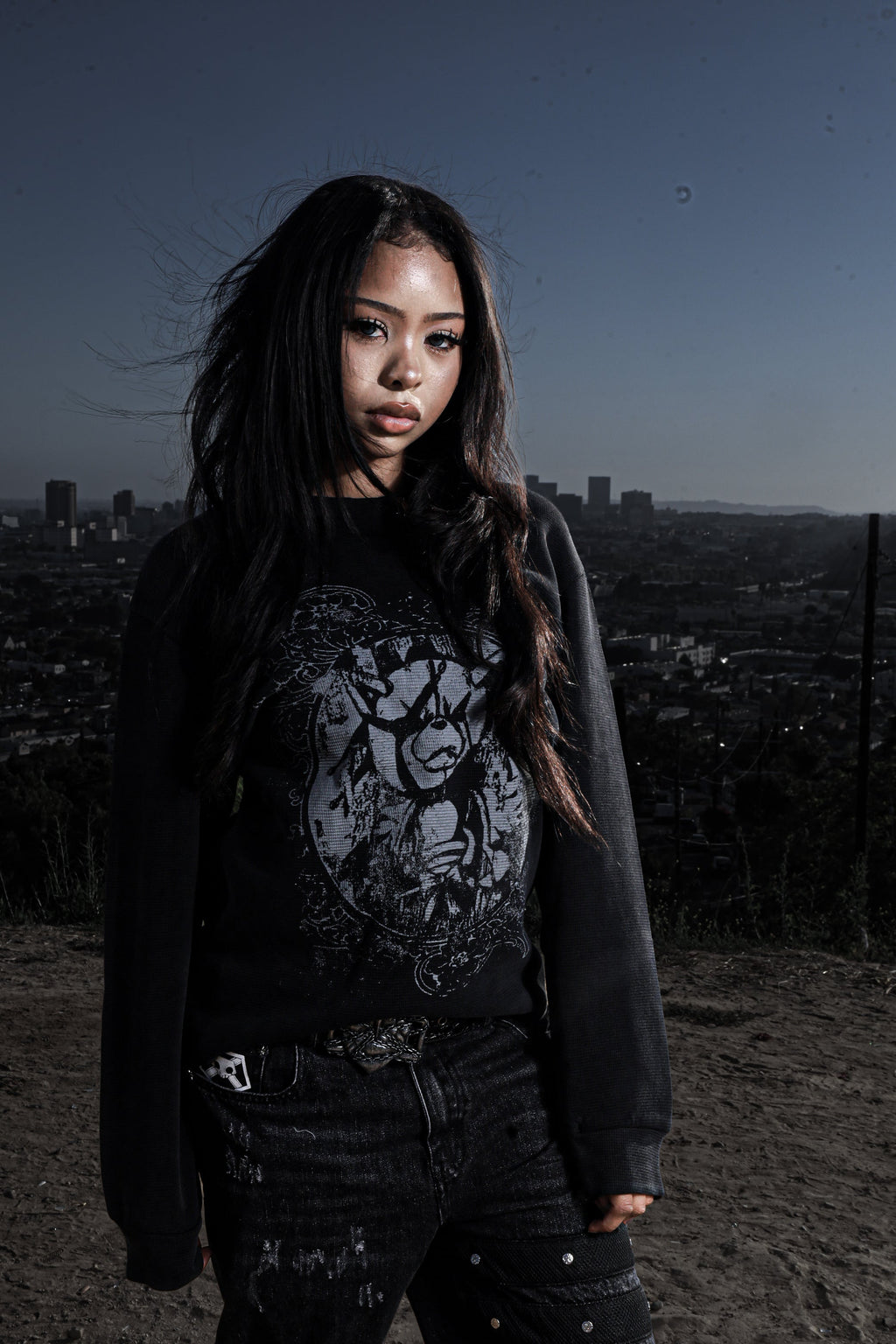 Women's black crewneck sweatshirt with monochrome graphic front print