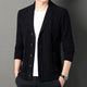 Men's textured cable knit cardigan with shawl collar and button front