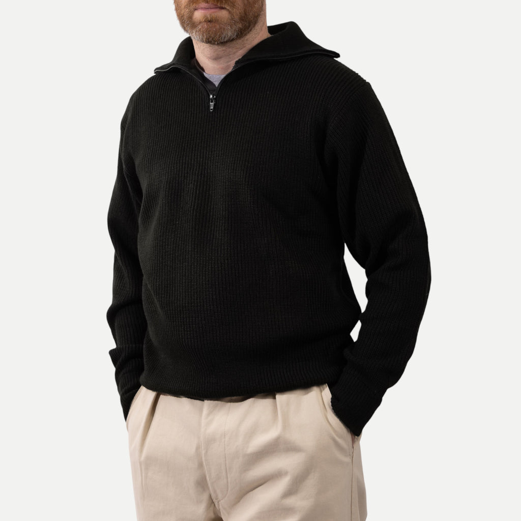 Men's black ribbed half-zip sweater with high collar