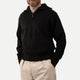 Men's black ribbed half-zip sweater with high collar