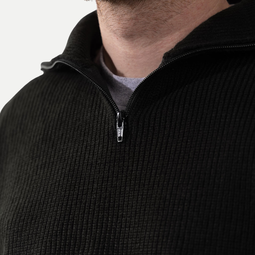 Men's black ribbed half-zip sweater with high collar