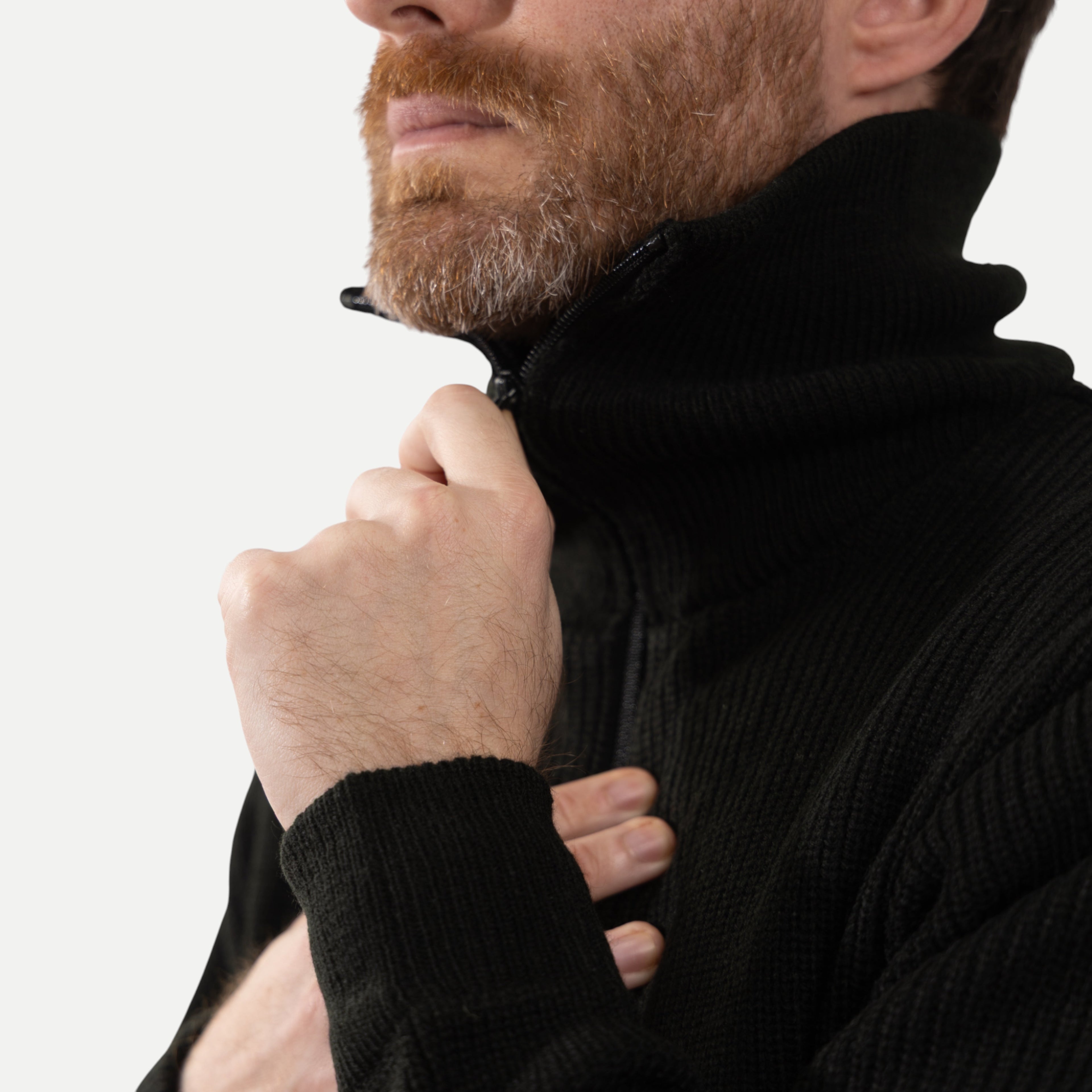 Men's black ribbed half-zip sweater with high collar
