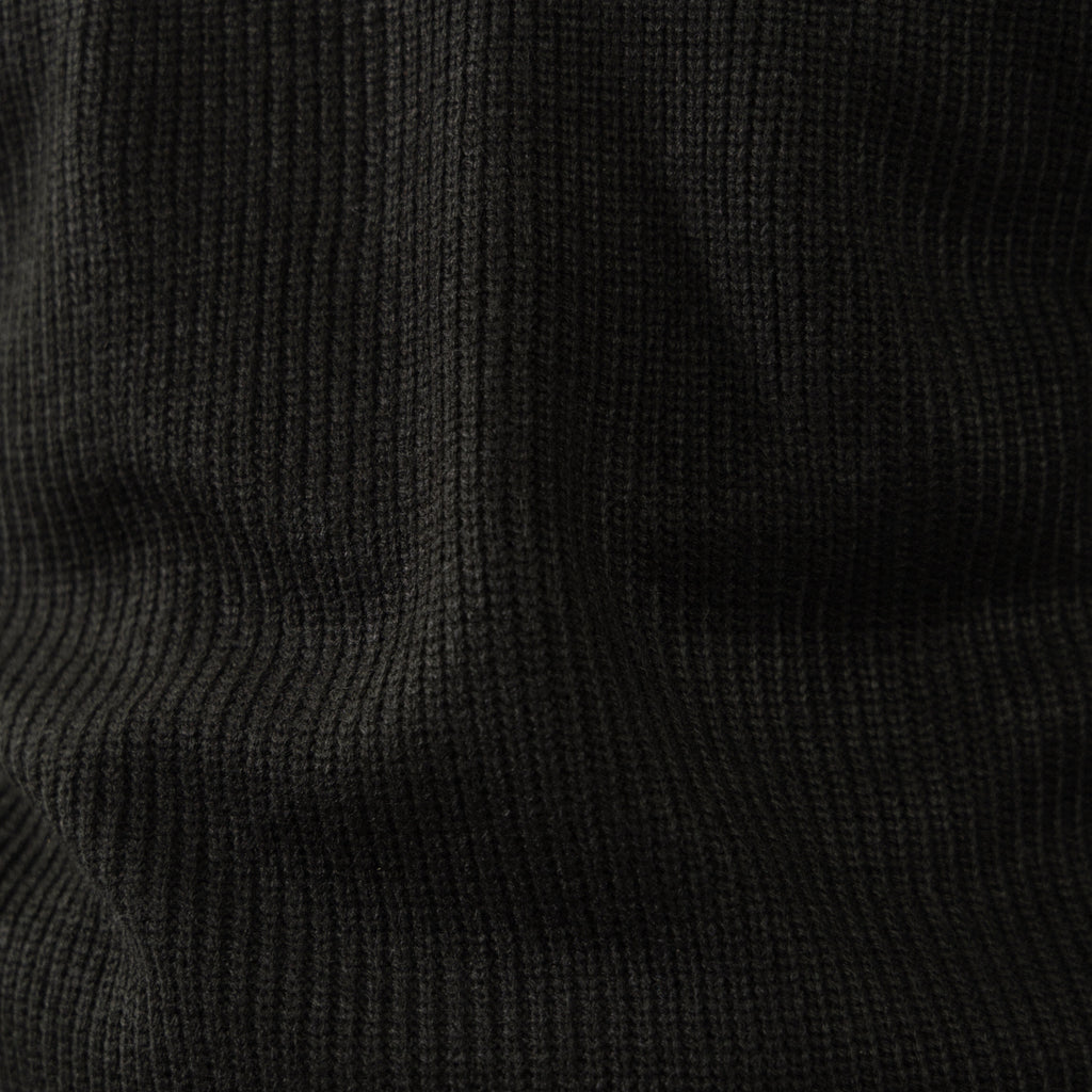 Men's black ribbed half-zip sweater with high collar