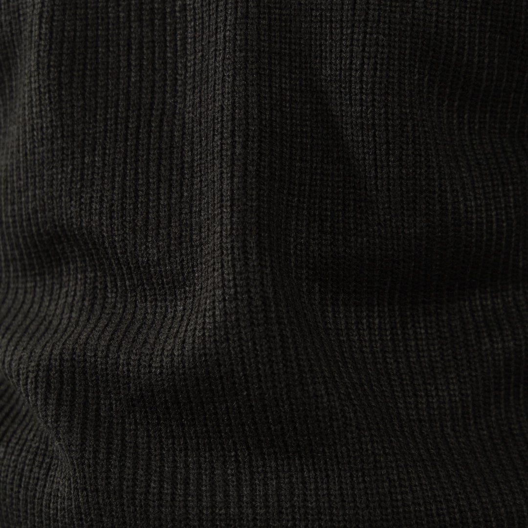 Men's black ribbed half-zip sweater with high collar