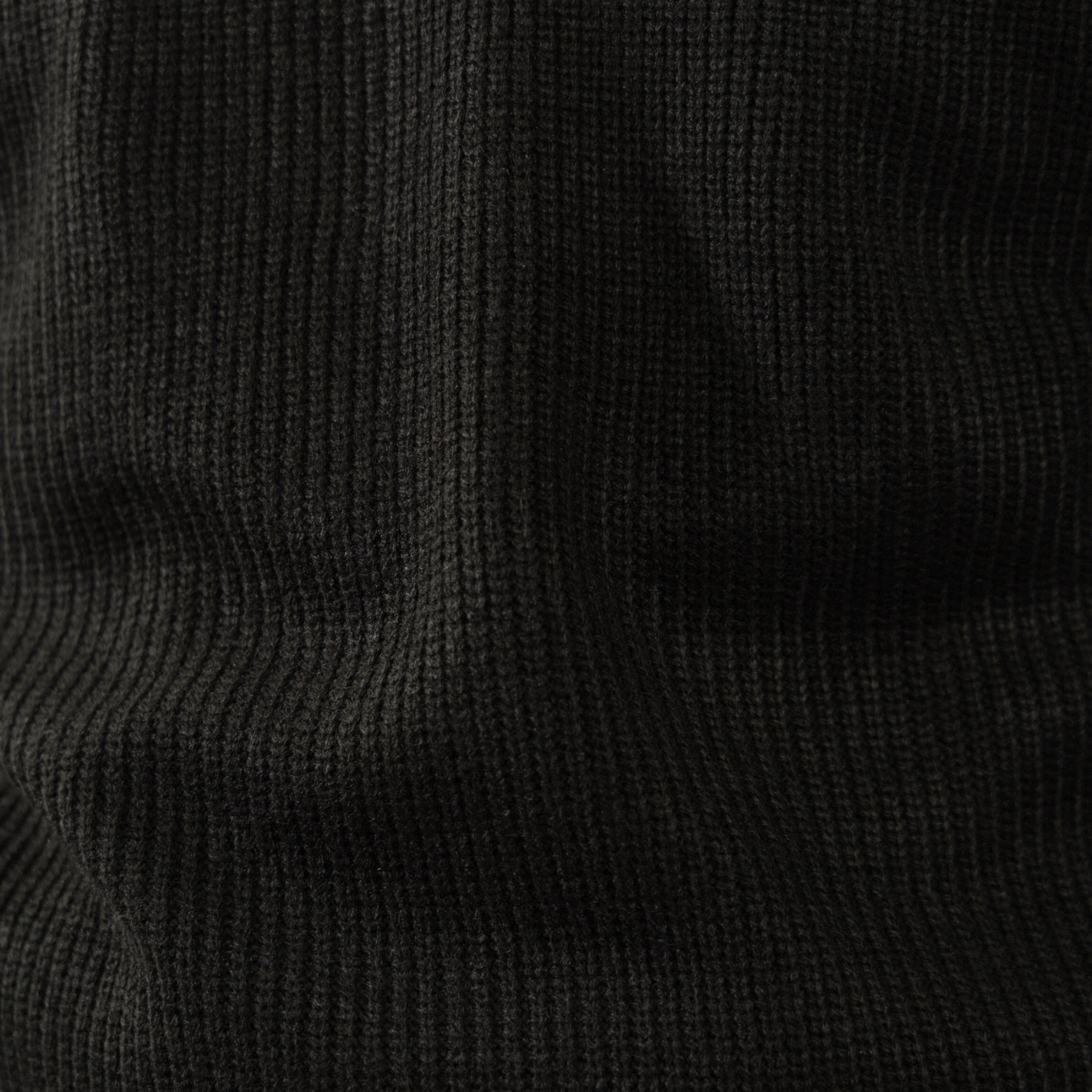 Men's black ribbed half-zip sweater with high collar
