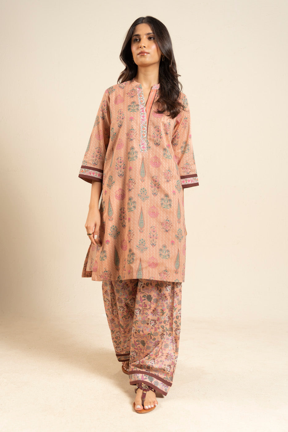 Women's peach floral shirt and trouser set with mandarin collar and patterned trims