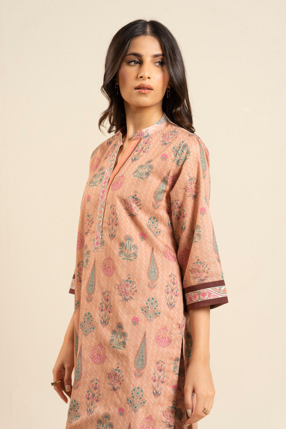 Women's peach floral shirt and trouser set with mandarin collar and patterned trims