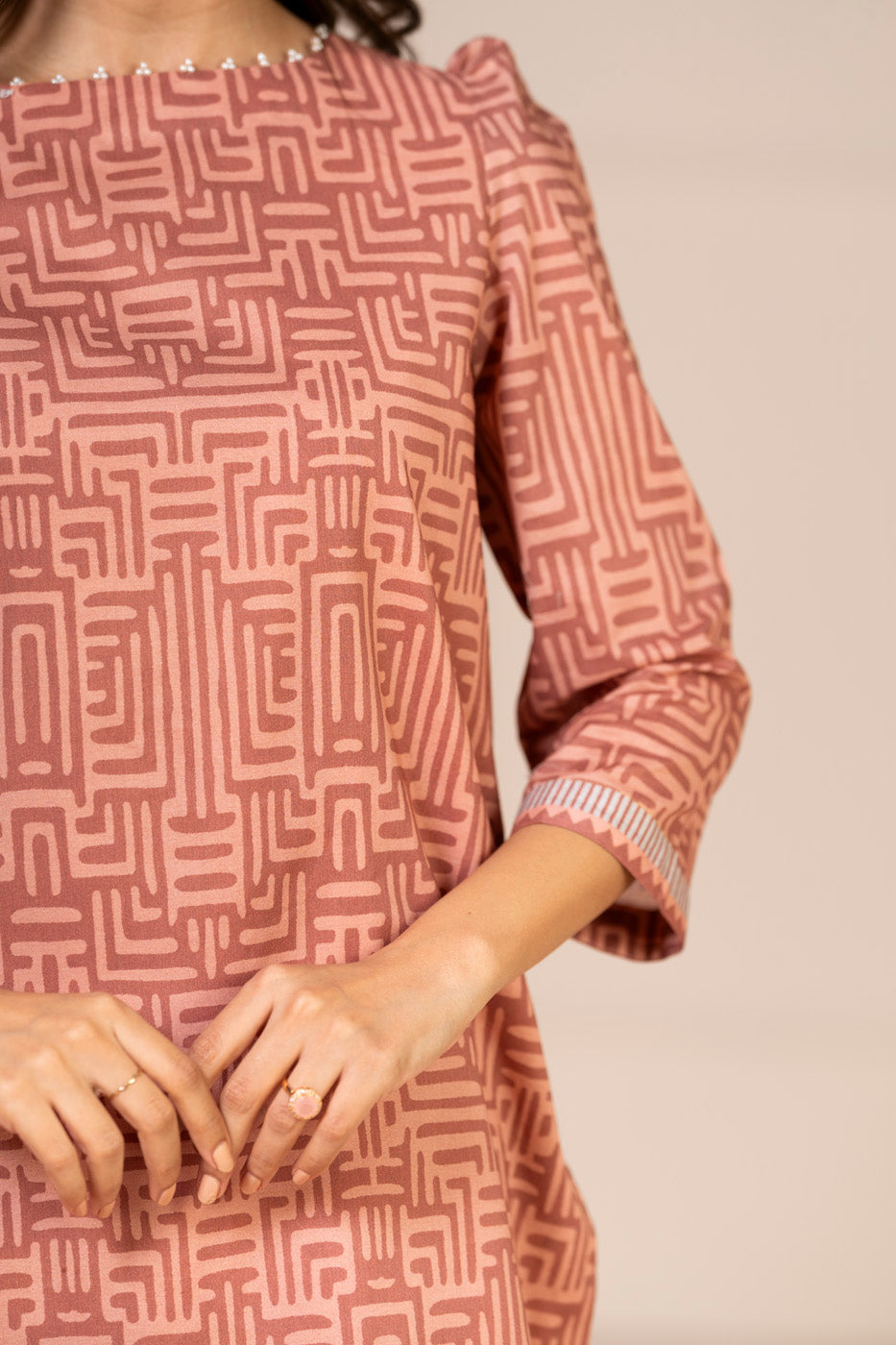 Women's peach geometric shirt and dupatta set with 3/4 sleeves and wide-leg trousers