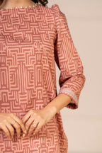Women's peach geometric shirt and dupatta set with 3/4 sleeves and wide-leg trousers