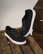 Classic low-top lace-up sneakers with textured upper and contrasting sole