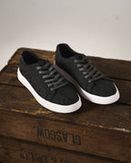 Classic low-top lace-up sneakers with textured upper and contrasting sole