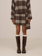 Women's brown plaid mini skirt with high waist and fringed hem
