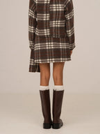 Women's brown plaid mini skirt with high waist and fringed hem