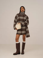 Women's brown plaid mini skirt with high waist and fringed hem