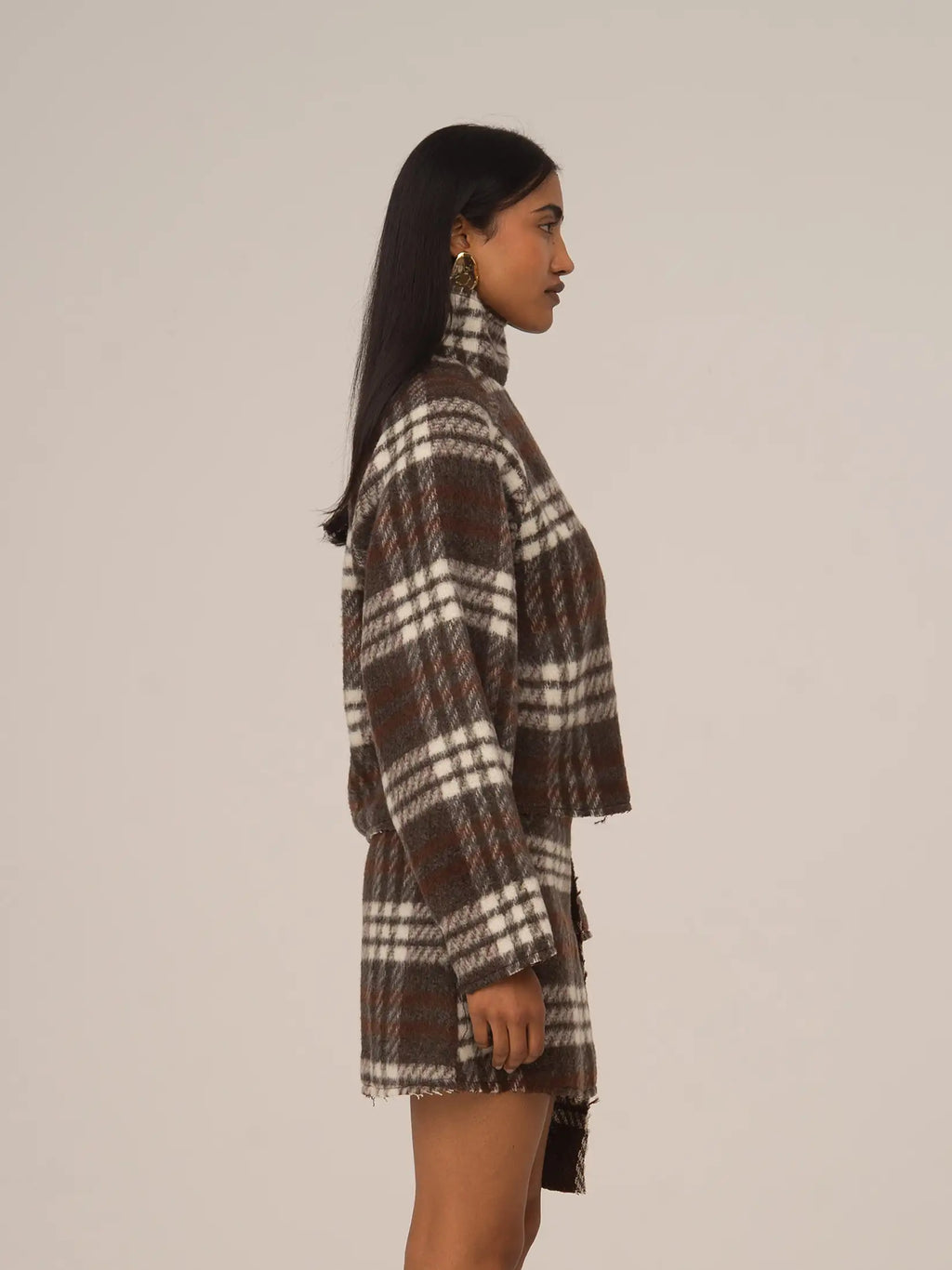 Women's brown plaid cropped turtleneck top with long sleeves and fringed edges