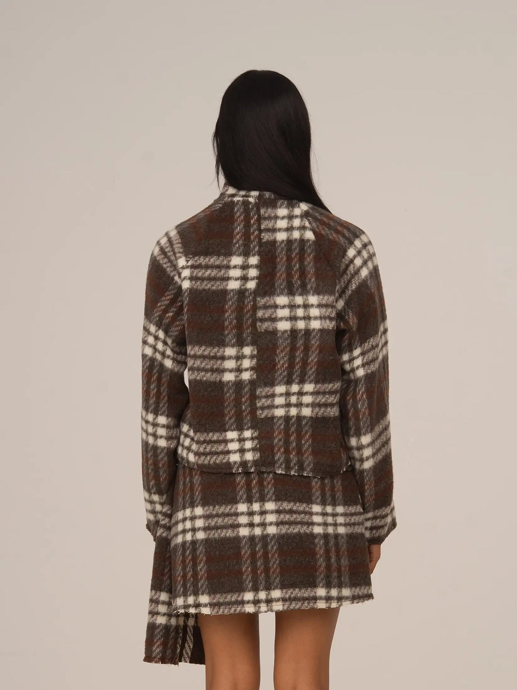 Women's brown plaid cropped turtleneck top with long sleeves and fringed edges
