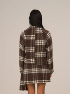 Women's brown plaid cropped turtleneck top with long sleeves and fringed edges