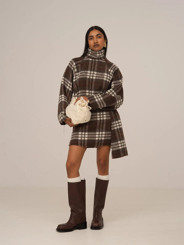 Women's brown plaid cropped turtleneck top with long sleeves and fringed edges