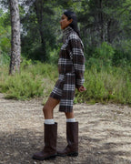 Women's brown plaid cropped turtleneck top with long sleeves and fringed edges