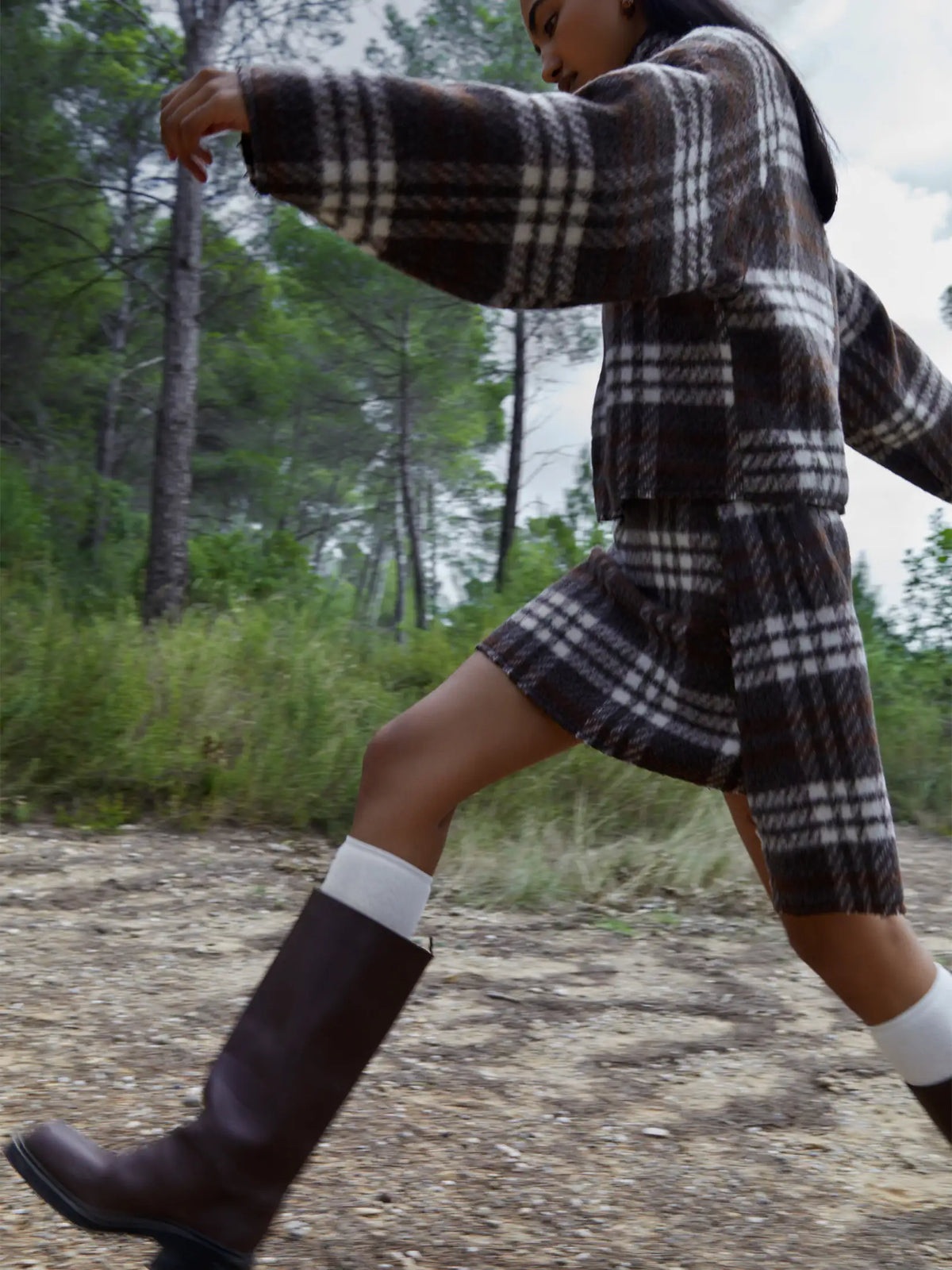Women's brown plaid cropped turtleneck top with long sleeves and fringed edges