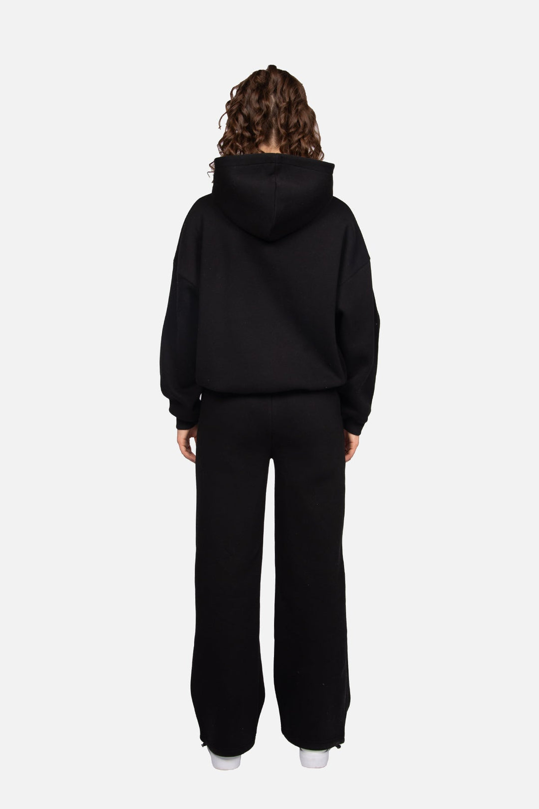 Women's black cropped hoodie with pink chest logo